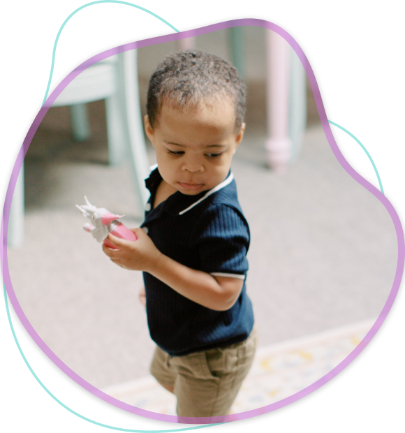Child Holding Toy